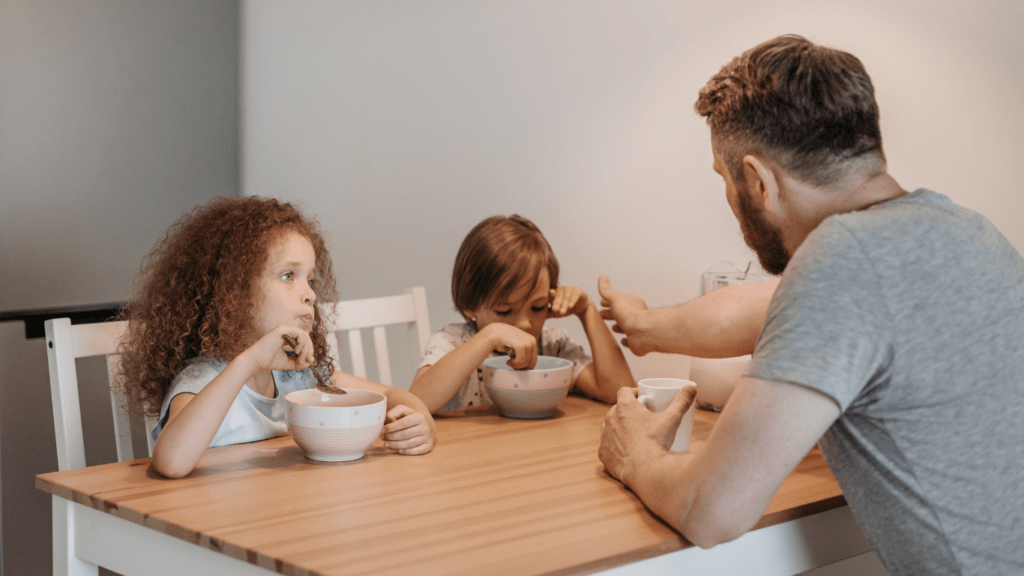 A parent and child having breakfast at home