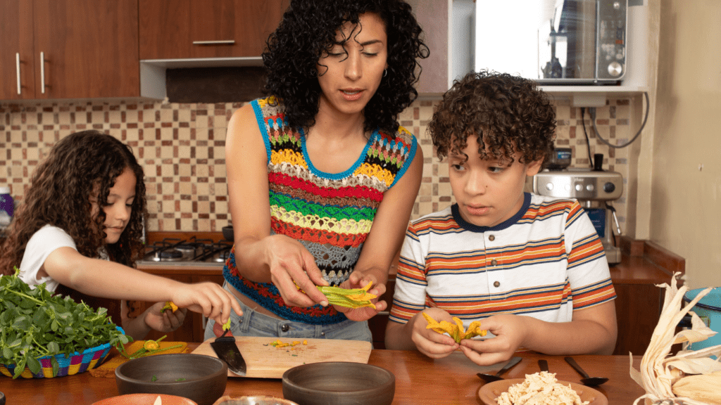 Two children preparing food in the kitchen