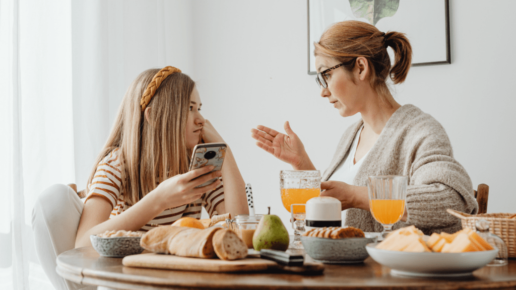 A parent and child having breakfast at home