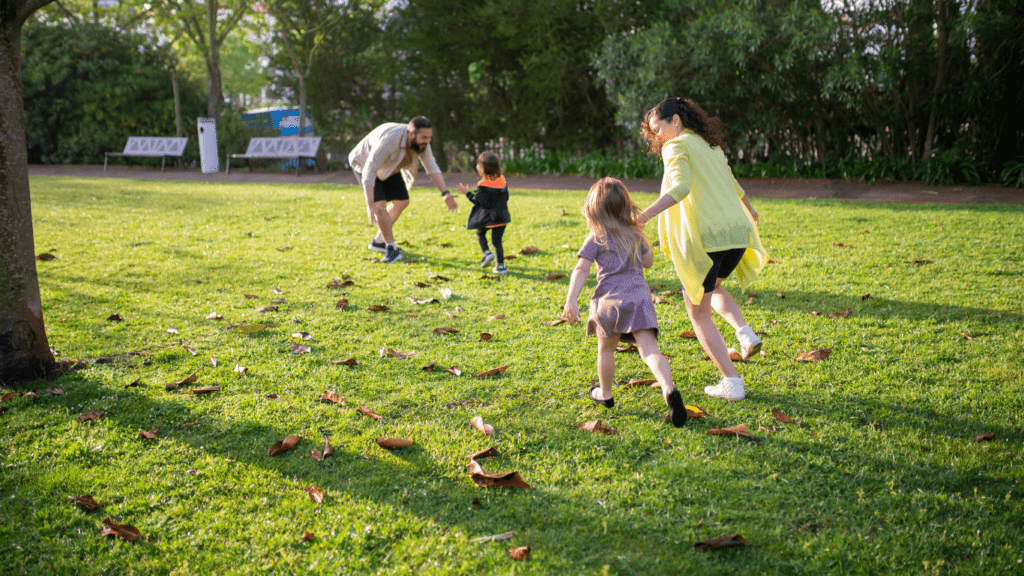 an image of a family playing in the park