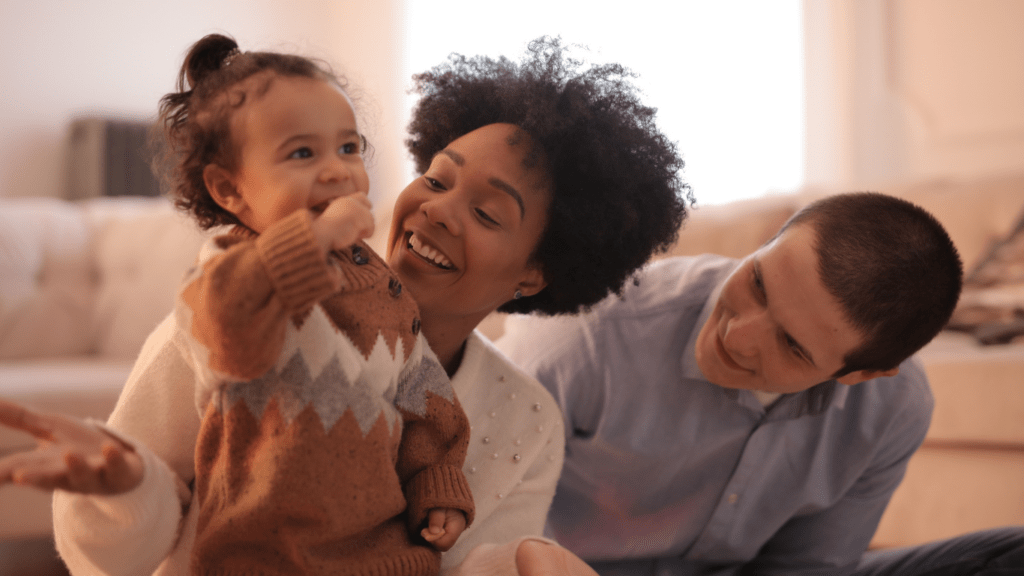 a family sitting on the floor