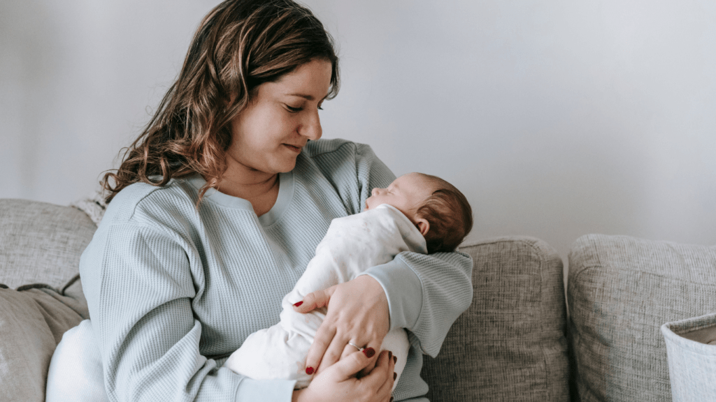 a person holding a baby in their arms