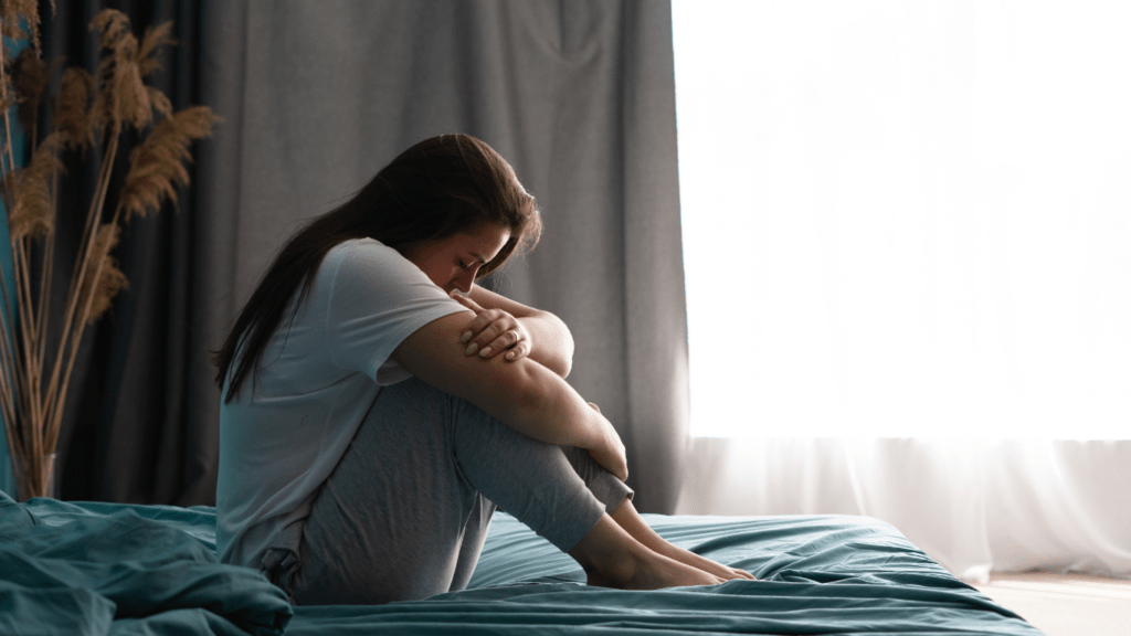 a person sitting on the bed