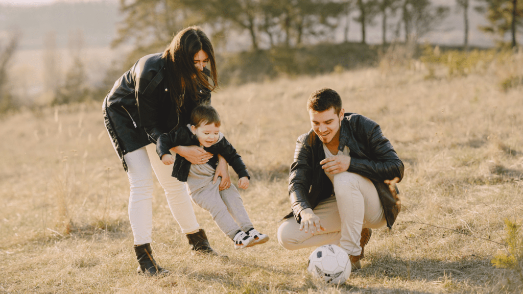 family playing at the park