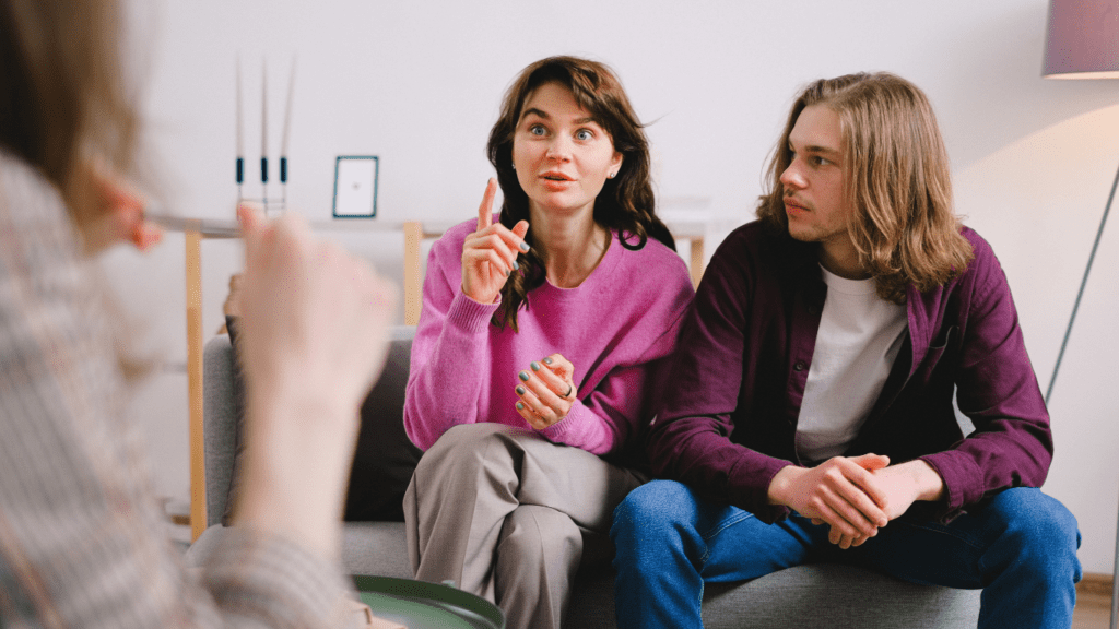 people sitting on a couch talking