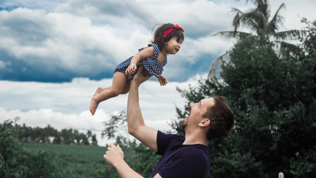 person holding a child in the air