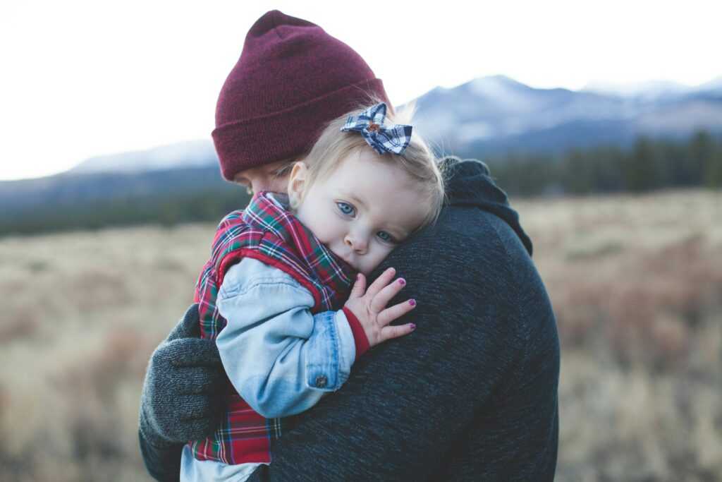 Man Carrying a Baby